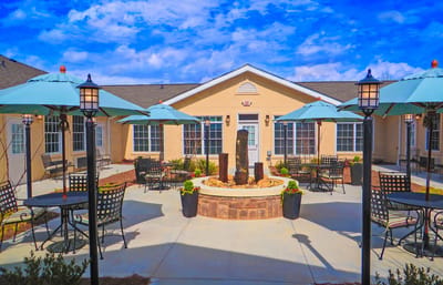 Outdoor seating area with tables and umbrellas