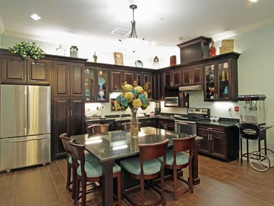 Bright kitchen area with dining table and modern appliances