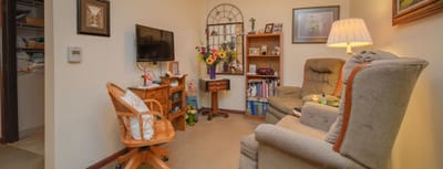 Cozy resident room with comfortable seating and decor