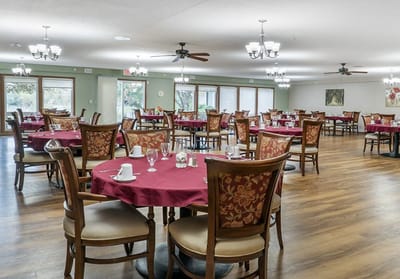Bright dining room with tables set for meals