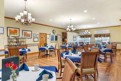 Dining room with tables set for residents