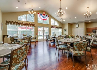 Bright dining room with tables and floral decor