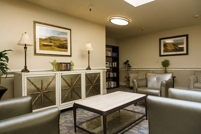 Bright common area with seating and bookshelves