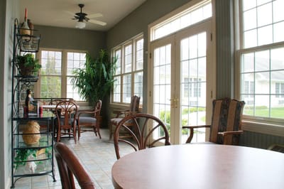 Bright common area with large windows and seating
