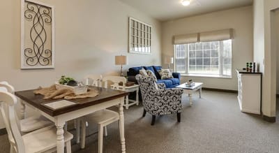 Bright common area with seating and dining furniture