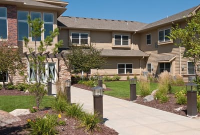 Outdoor view of the facility with gardens and walkways