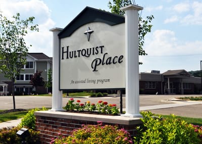 Exterior sign of Hultquist Place with landscaping