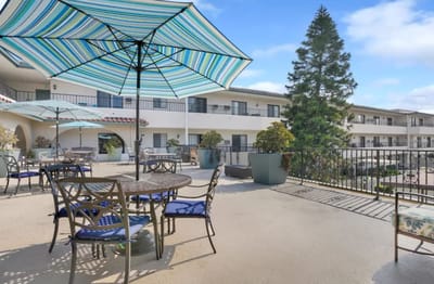 Outdoor patio area with tables and umbrellas