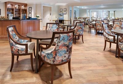 Interior view of a dining area with floral chairs