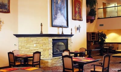Dining area with tables and a fireplace