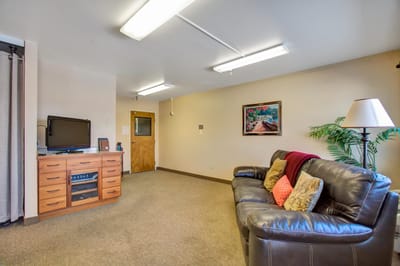 Cozy interior lounge area with a sofa and TV