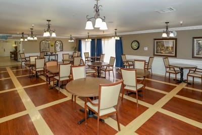 Dining area with empty tables and chairs