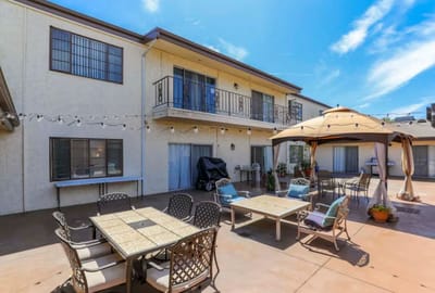 Outdoor patio area with seating and shade