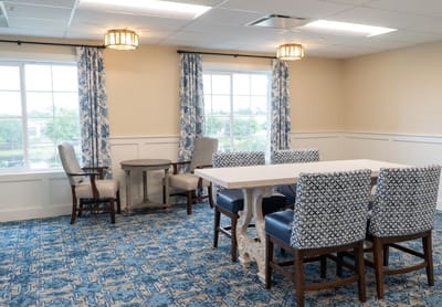 Bright common area with seating and tables