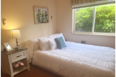 Cozy bedroom with a bed and bedside table
