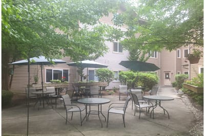 Outdoor patio area with seating and umbrellas