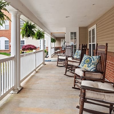 Porch area with rocking chairs and plants