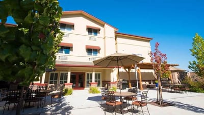 Exterior view of the facility with outdoor seating area