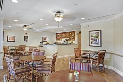 Bright and inviting interior common area with dining tables