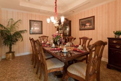Elegant dining room set for a meal.