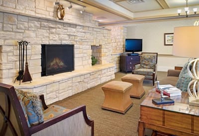 Cozy lounge area with fireplace and seating