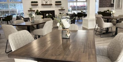 Modern dining area with tables and floral centerpieces