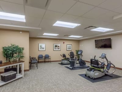 Interior fitness room with workout equipment