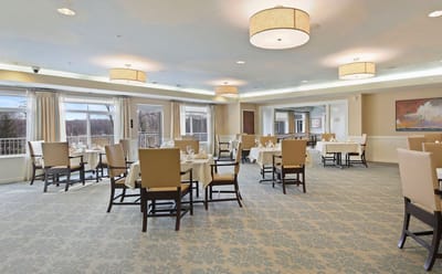 Bright dining room with tables set for meals