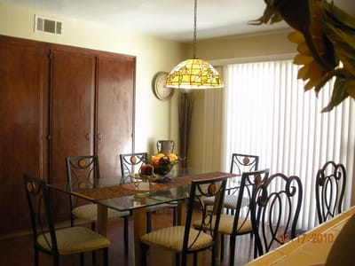 Interior dining room with a long glass table