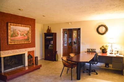 Bright interior common area with a desk and decor