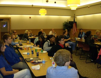 Residents and staff attending a gathering in a common area
