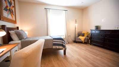 Comfortable private resident room with natural light