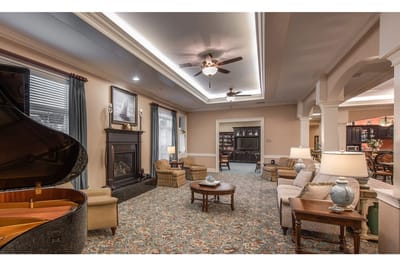Cozy common area with seating and a piano
