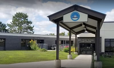 Entrance view of Boundary Waters Care Center with signage