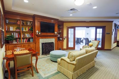 Cozy common area with seating and bookshelves