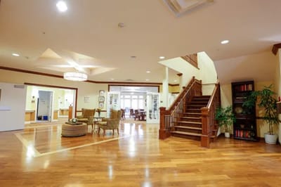 Interior view of a common area with seating and stairs