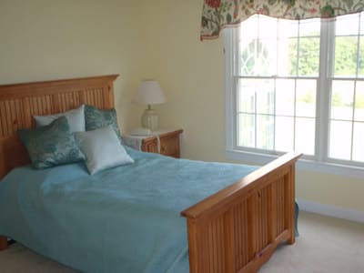 A well-furnished private bedroom in a senior living facility