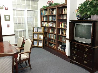 Interior of a cozy common area with bookshelves
