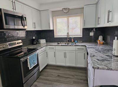 Bright, modern kitchen with granite countertops