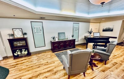 Common area with piano and welcoming decor