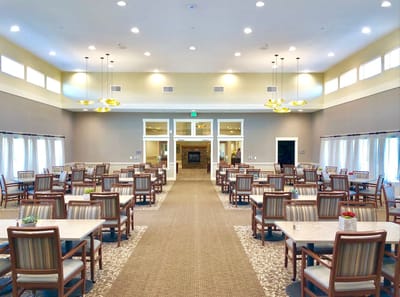 Interior view of a dining room with tables and chairs