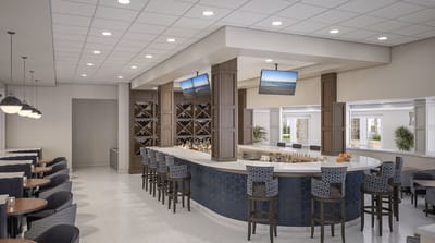 Bright and modern bar area with seating in a communal space
