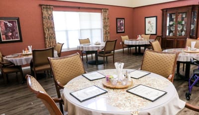 Dining area with tables set for residents