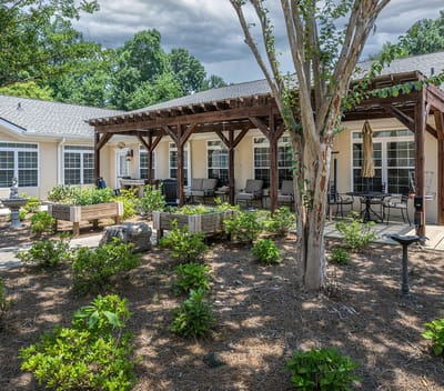 Outdoor patio area with seating and landscaping