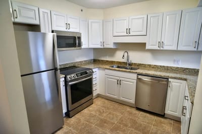 A bright kitchen area in a resident unit