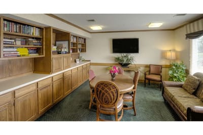 Bright common area with bookshelves and seating
