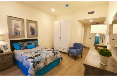 Cozy private resident room with a bed and decor