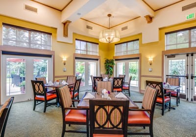 Bright dining room with tables and chairs