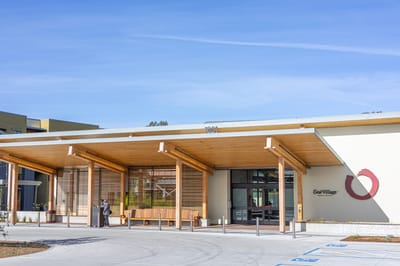 Entrance of Enso Village with staff and residents