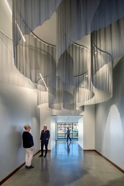 Interior view of a modern corridor with art installation